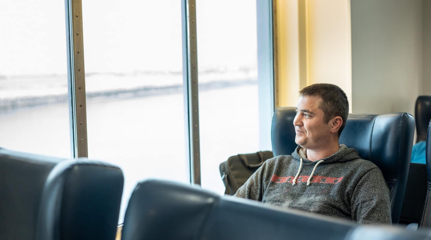A DFDS Freight and Logistics driver sitting inside a vessel