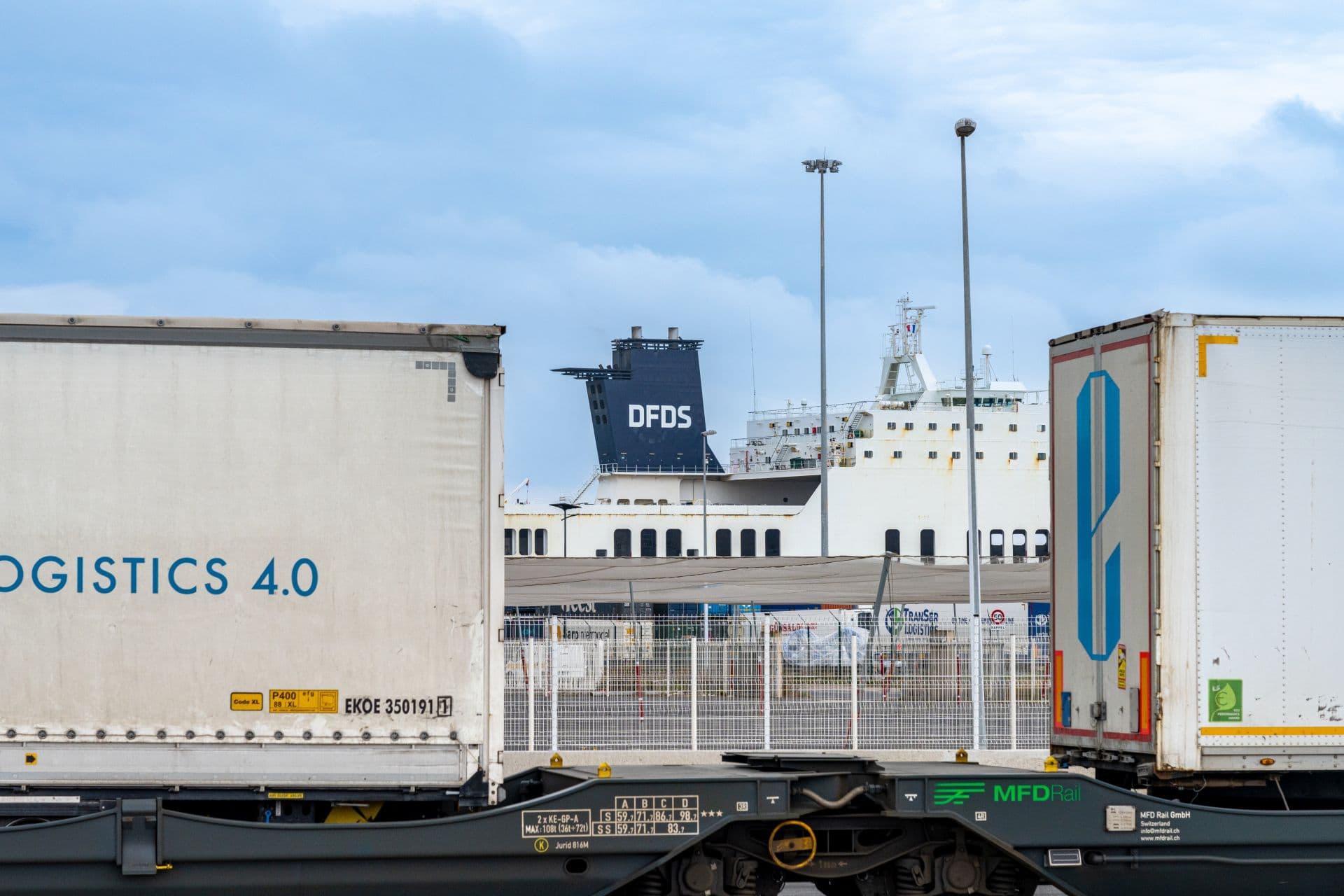 DFDS vessel seen between containers on train