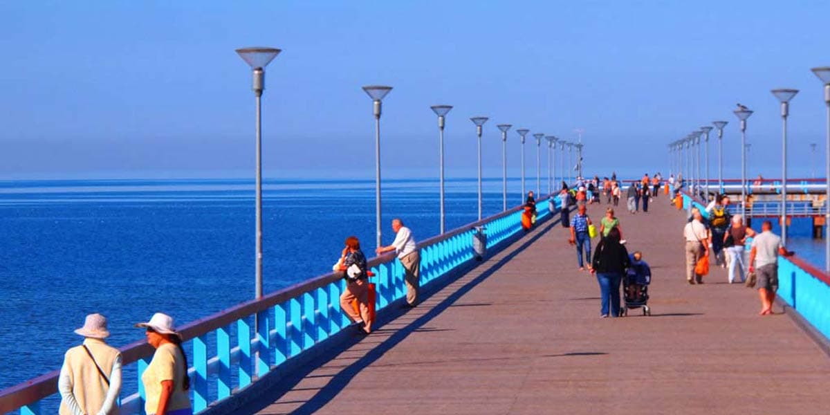 People enjoying the view from the pier in Palange