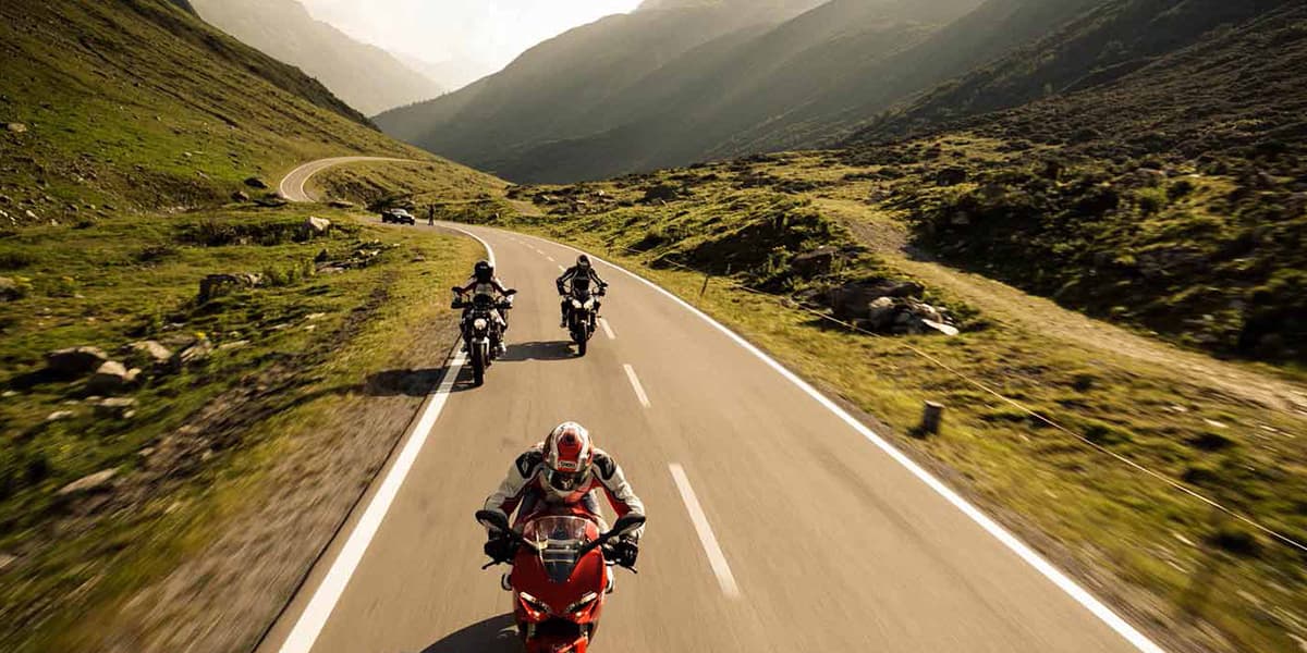 Group of 3 motorcycling on a road trip