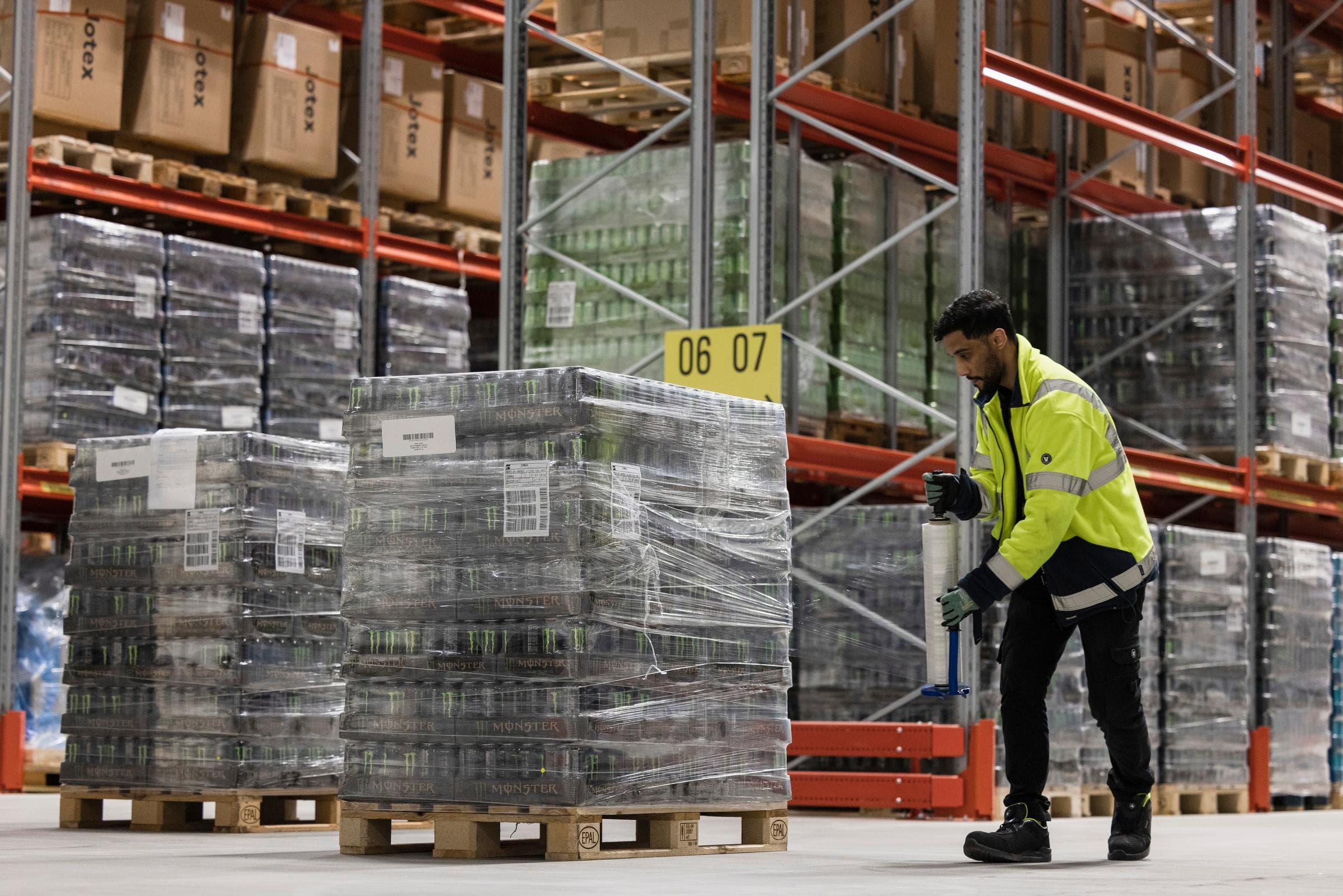 Worker Handling Pallets
